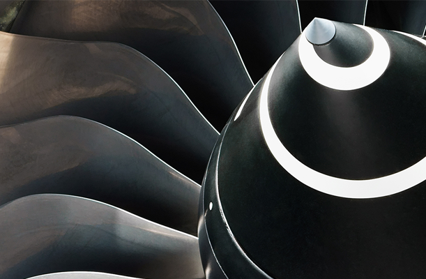Close up of the nose cowl of a Rolls Royce jet engine turbine intake.