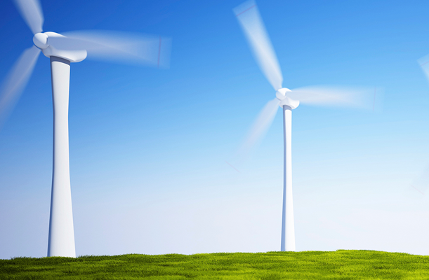 Wind turbines on green grass field