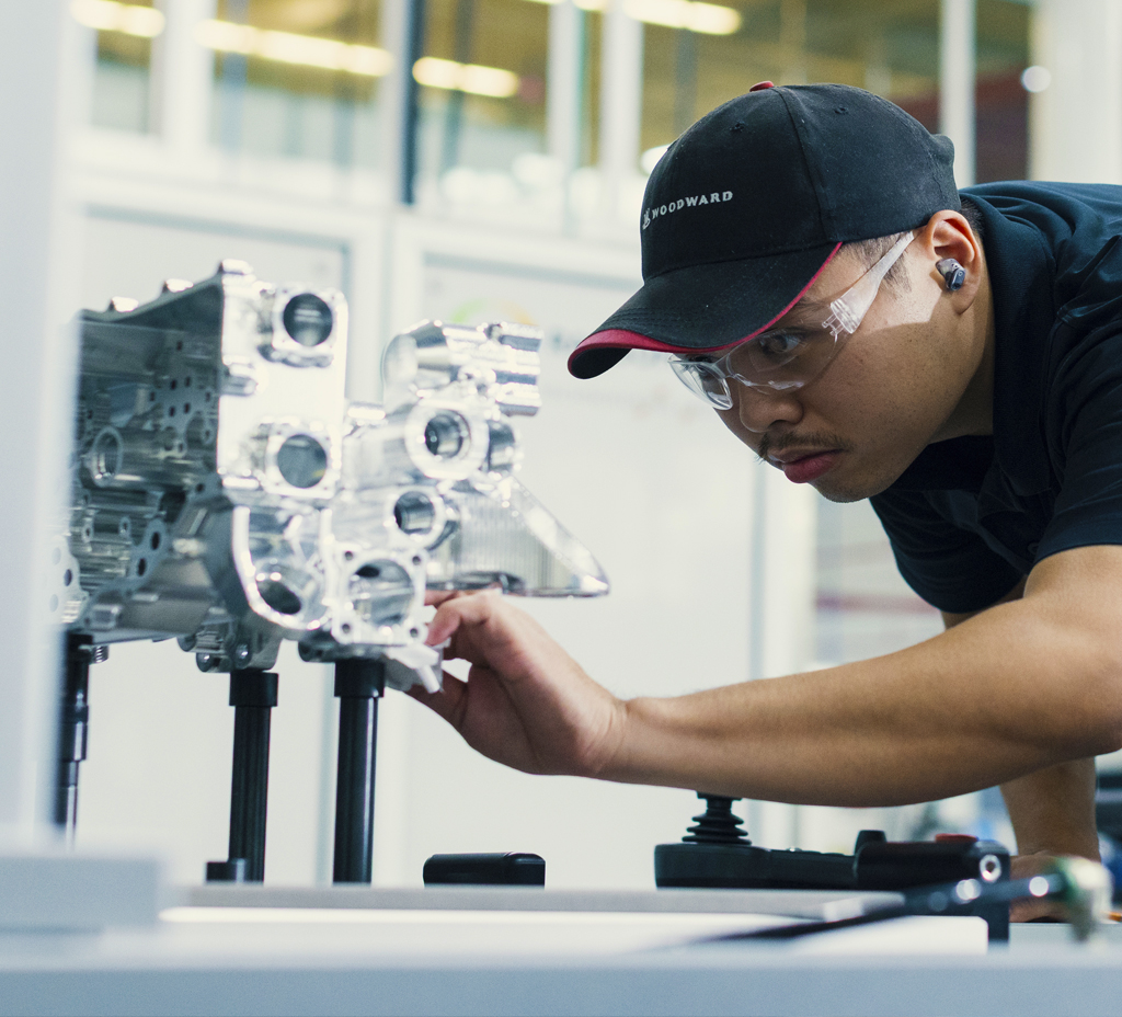 Man working on Aerospacce product in a manufacturing setting